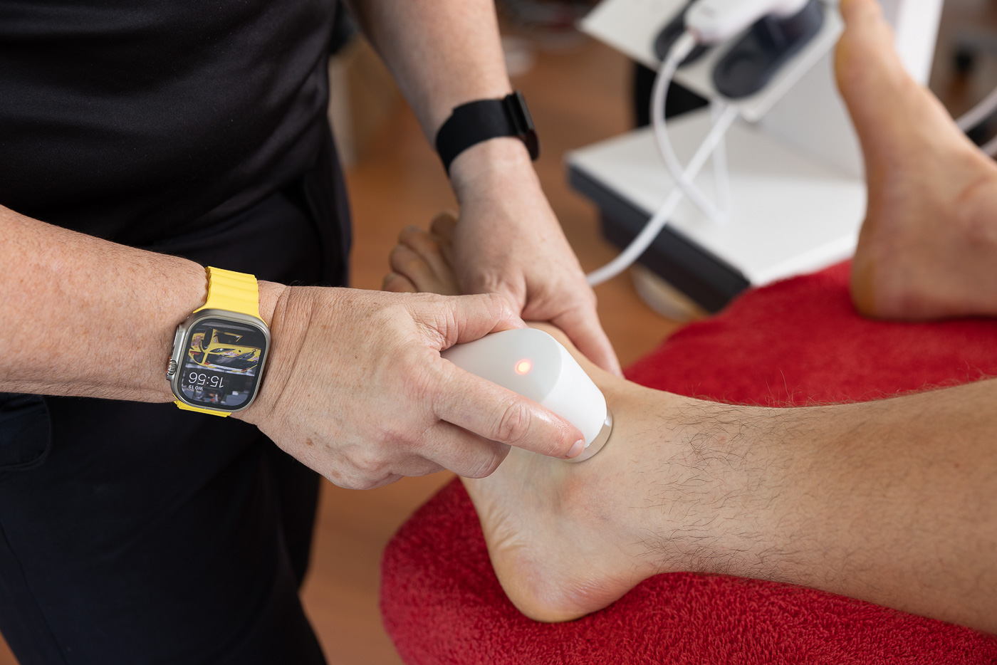 Therapist treating a patient with the ultrasound head